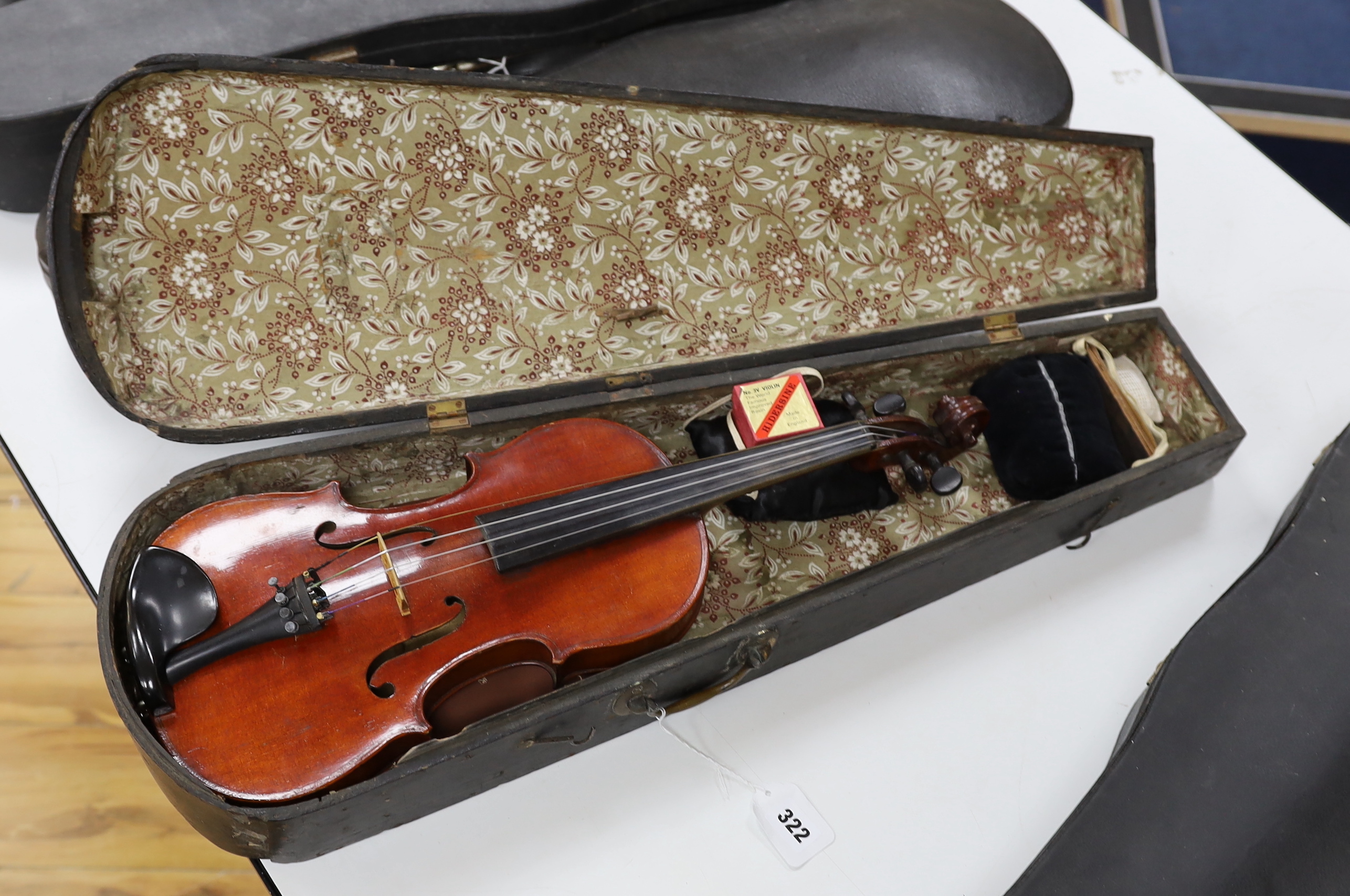 A wooden cased student violin